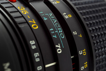 close-up part of the zoom photographic lens with printed information