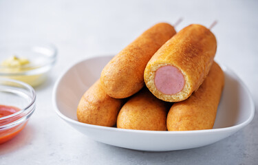 Corn dog. Asian hot dog with sauces. Street food