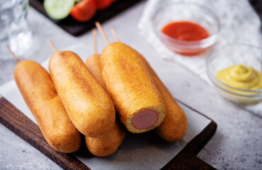 Corn dog. Asian hot dog with sauces. Street food
