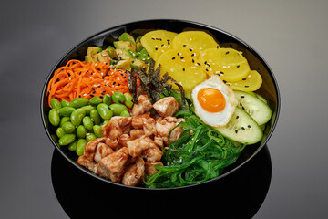 Chicken poke in sauce with vegetables and fruits