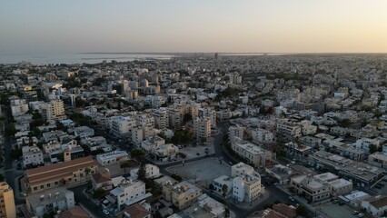 Incredible view of Limassol city at sunset. Urban infrastructure. The view from the drone. Amazing view in Cyprus.