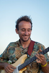 man playing guitar