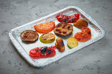 Grilled vegetable slices on a concrete background