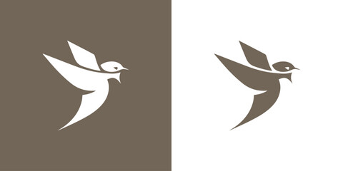 Fototapeta premium Logo bird soaring in the sky swallow minimalism
