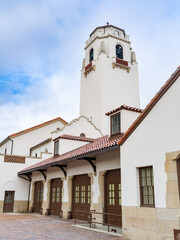 Close up of a white stucco train depot