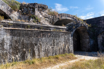 Fototapeta na wymiar Gulf Islands National Seashore along Gulf of Mexico barrier islands of Florida. Fort Pickens pentagonal historic United States military fort on Santa Rosa Island. Brick casemate arches. 