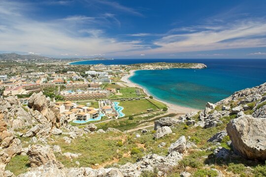 View of town of Kolymbia and sandy beach in sunny spring weather, Rhodes, Greece.