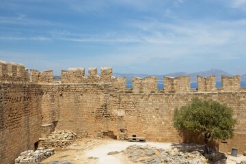 Fototapeta premium Stone wall of Lindos ancient acropolis and medieval castle, Rhodes island, Greece.
