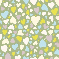 Seamless hearts pattern on green background 