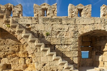 View of Rhodes fortress wall and stairs on a sunny day, Old Town of Rhodes, Greece.
