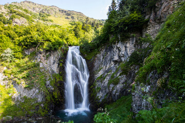Fototapeta na wymiar Summer in Sauth Deth Pish waterfall, Val D Aran, Spain