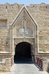 Gate of Agios Ioannis (St. John) in sunny weather in spring, Rhodes fortress, Greece.