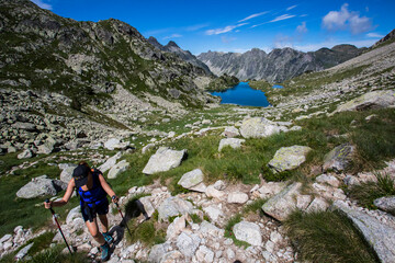 Fototapeta premium Young hiker girl summit to Montardo Peak in AIguestortes and Sant Maurici National Park, Spain