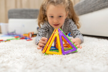 Figures from the magnetic designer. The development of fine motor skills and imagination of the child.