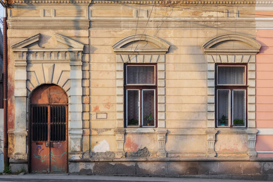 vintage door and windows on the grunge facade. abandoned architecture exterior