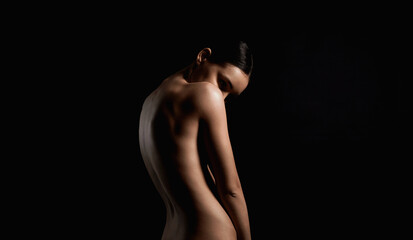 Nude Woman silhouette. Back of Beautiful Naked Body Girl