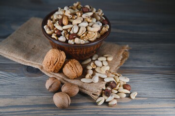 Various nuts on a plate, top view.