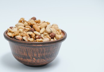 Various nuts on a plate, top view.