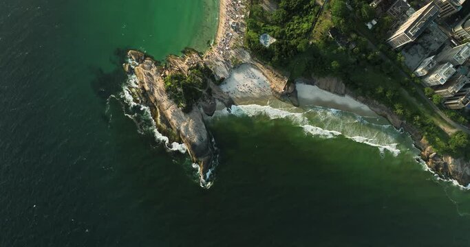 Aerial high angle view of people watching sunset on Arpoador Peninsula between Ipanema and Copacabana Beach, Rio De Janeiro, Brazil