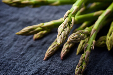 Green asparagus on a dishcloth.