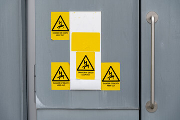 High voltage yellow danger sign on boiler room door