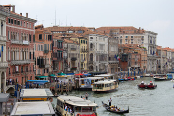 Fototapeta na wymiar Venetian canals with countless boats and gondolas. 