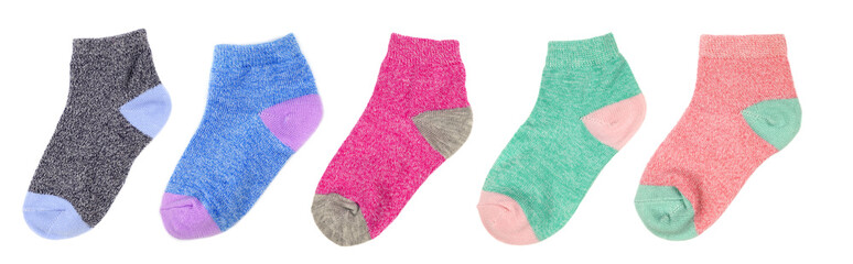 Different colored children's socks isolated on white