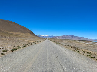 The road to the mountains on the border with China.