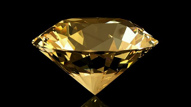 Beautiful sparkling citrine crystal rotating on a black background. Looping animation