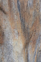 Gold brown and grey stone patterns with stripes from riverbed of Vale Verzasca in Switzerland