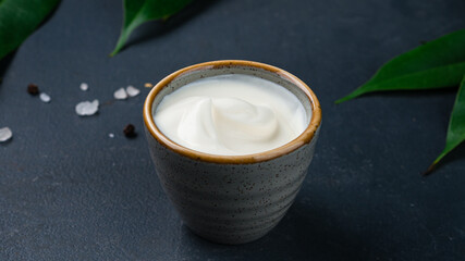 Sour cream sauce in a small bowl.