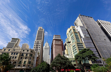 Fototapeta premium View of the buildings in Anhangabaú Valley with a blue sky in the background. Downtown of São Paulo city, Brazil