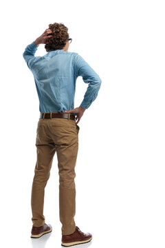 casual man scratching his head and feeling confused