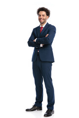 full body picture of elegant businessman smiling and crossing arms