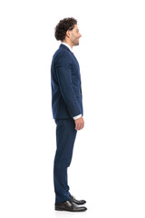 lebanese young man in navy blue suit being happy and smiling