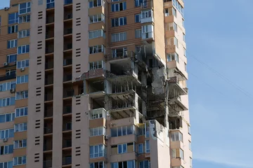 Zelfklevend Fotobehang Russian missile damaged multi-storey dwelling building in Kiev city, Ukraine © Harmony Video Pro