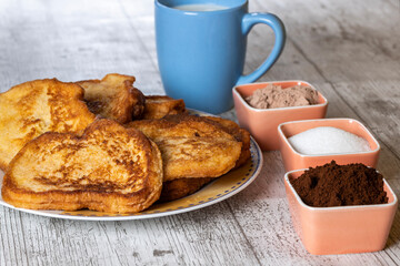 (Torrijas) Fried bread soaked in milk flavored with vanilla, cinnamon and lemon, and egg. Typical Easter sweet. Traditional and festive cuisine concept.