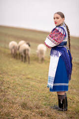 Young beautiful slovak woman in traditional dress. Slovak folklore