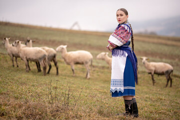 Young beautiful slovak woman in traditional dress. Slovak folklore