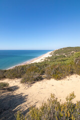 One of the most beautiful beaches in Spain, called (El Asperillo, Doñana, Huelva) in Spain.  Surrounded by dunes, vegetation and cliffs.  A gorgeous beach.