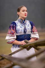 Young beautiful slovak woman in traditional dress. Slovak folklore
