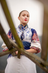 Young beautiful slovak woman in traditional dress. Slovak folklore