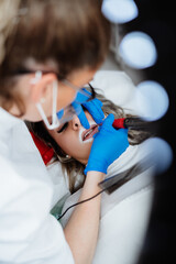 Professional permanent make up procedure. Tattoo lips makeup treatment in modern beauty salon.
