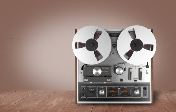 Vintage Music and sound - Retro reel to reel tapes recorder brown background
