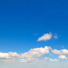Blue sky and cumulus clouds.