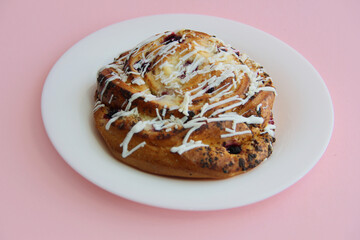 fresh pastries. currant pie is sprinkled with white chocolate. blueberry bun in white chocolate