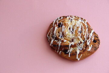 fresh pastries. currant pie is sprinkled with white chocolate. blueberry bun in white chocolate