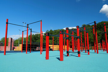 Sports ground with horizontal bars and other new exercise equipment