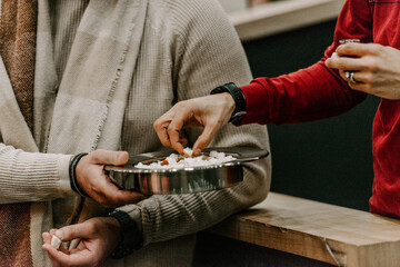 Communion with bread and wine during the service in the assembly