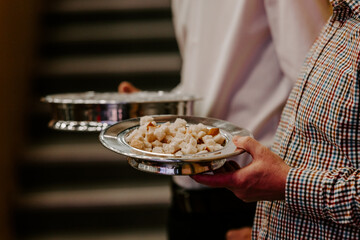 Communion with bread and wine during the service in the assembly